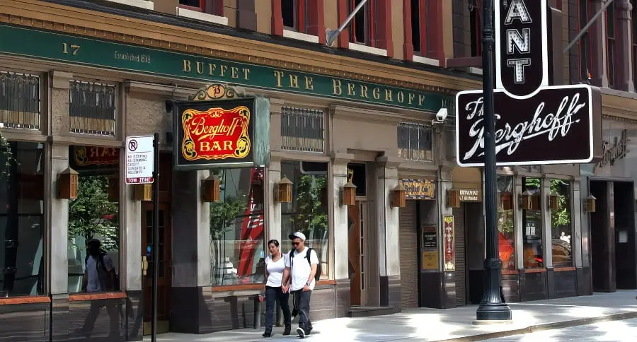 Exterior of The Berghoff restaurant on West Adams Street in Chicago, showing its vertical sign and entrance.